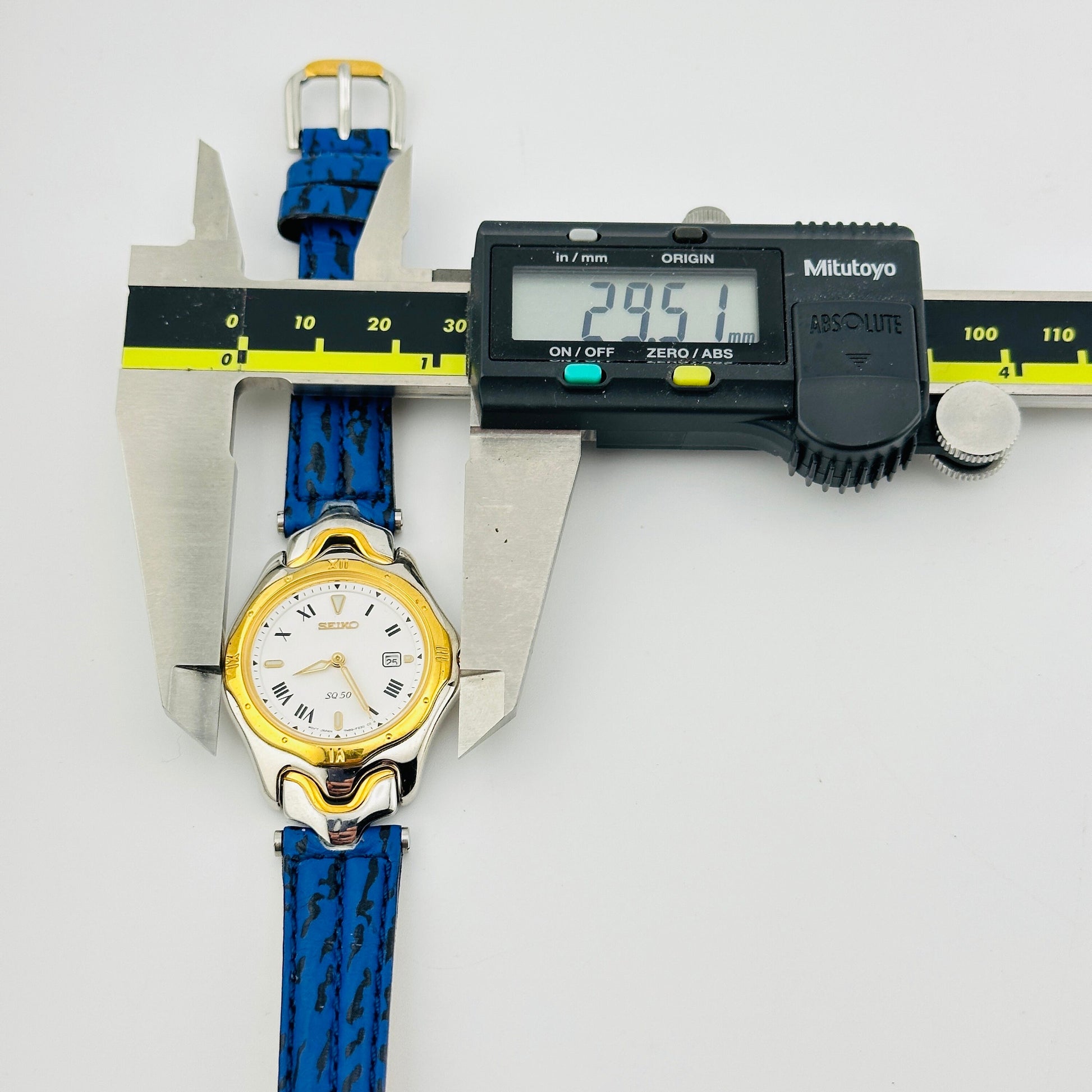 Seiko SQ 50 White Dial Gold Tone Ladies Quartz Wristwatch with Original Blue Strap