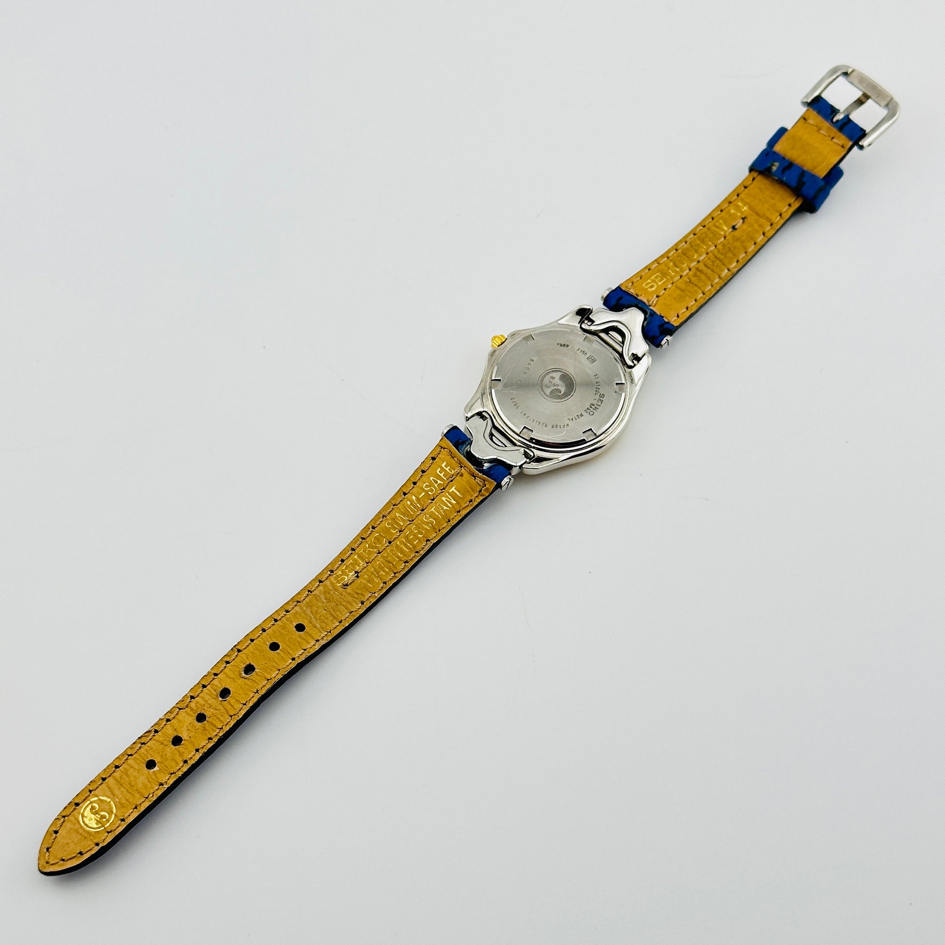 Seiko SQ 50 White Dial Gold Tone Ladies Quartz Wristwatch with Original Blue Strap